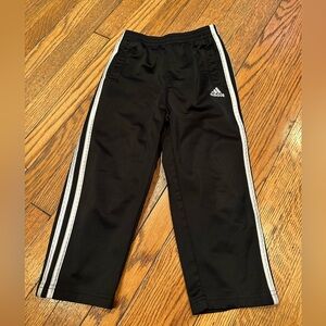 Adidas Kids Black and White Sweatpants with Signature Stripes and has Pockets